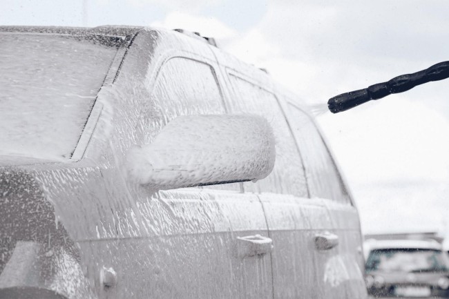 Car covered in foam at PUTO self-service car wash.