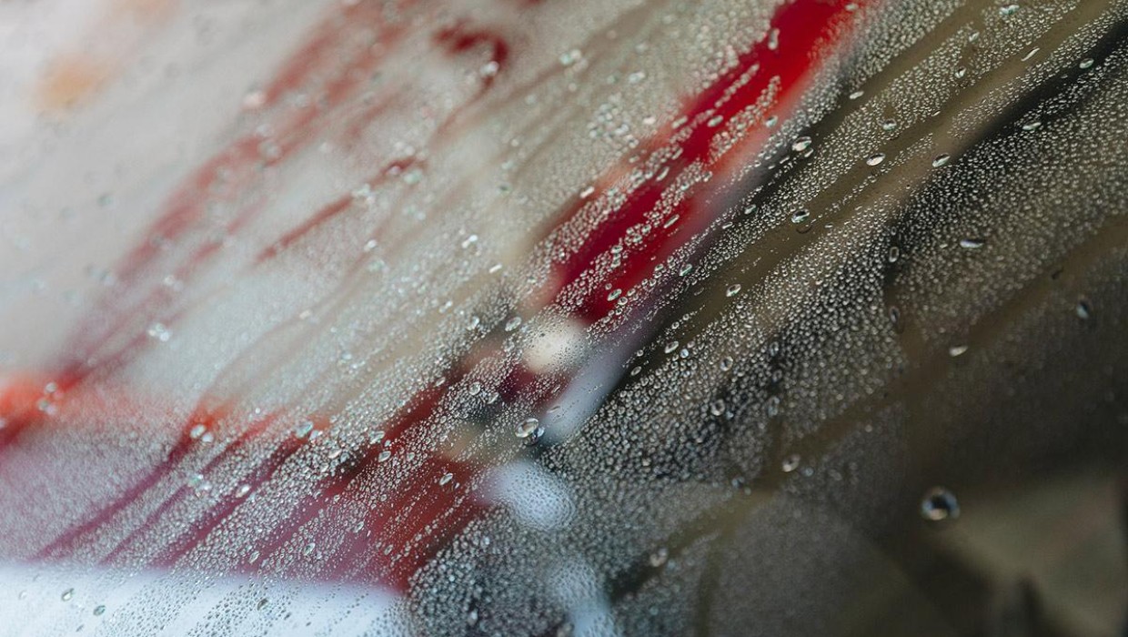 Water droplets on a car window during the celebration.