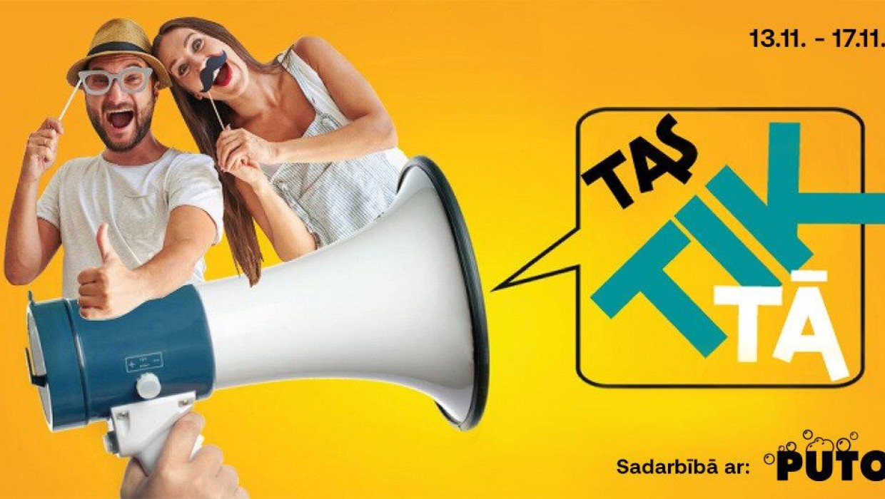 Promotional banner with two people posing excitedly, large megaphone, and text "Tas Tik Tā."